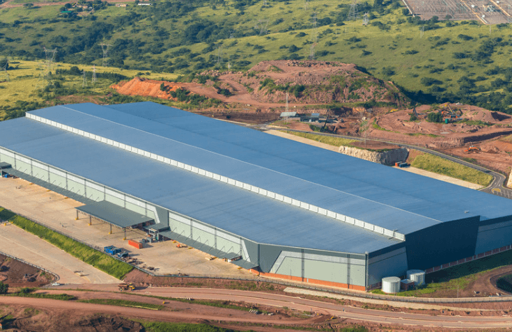 Large greenfield site with new warehouse surrounded by grass