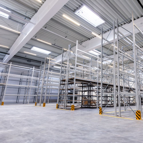 Empty warehouse with empty warehouse storage racking