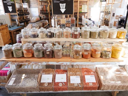 Gourmet shop with wood shelving and canisters of spices