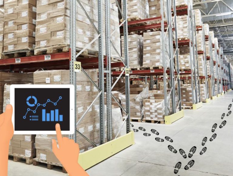 Storage aisles in warehouse with footprints going down aisles and person holding tablet with data metrics